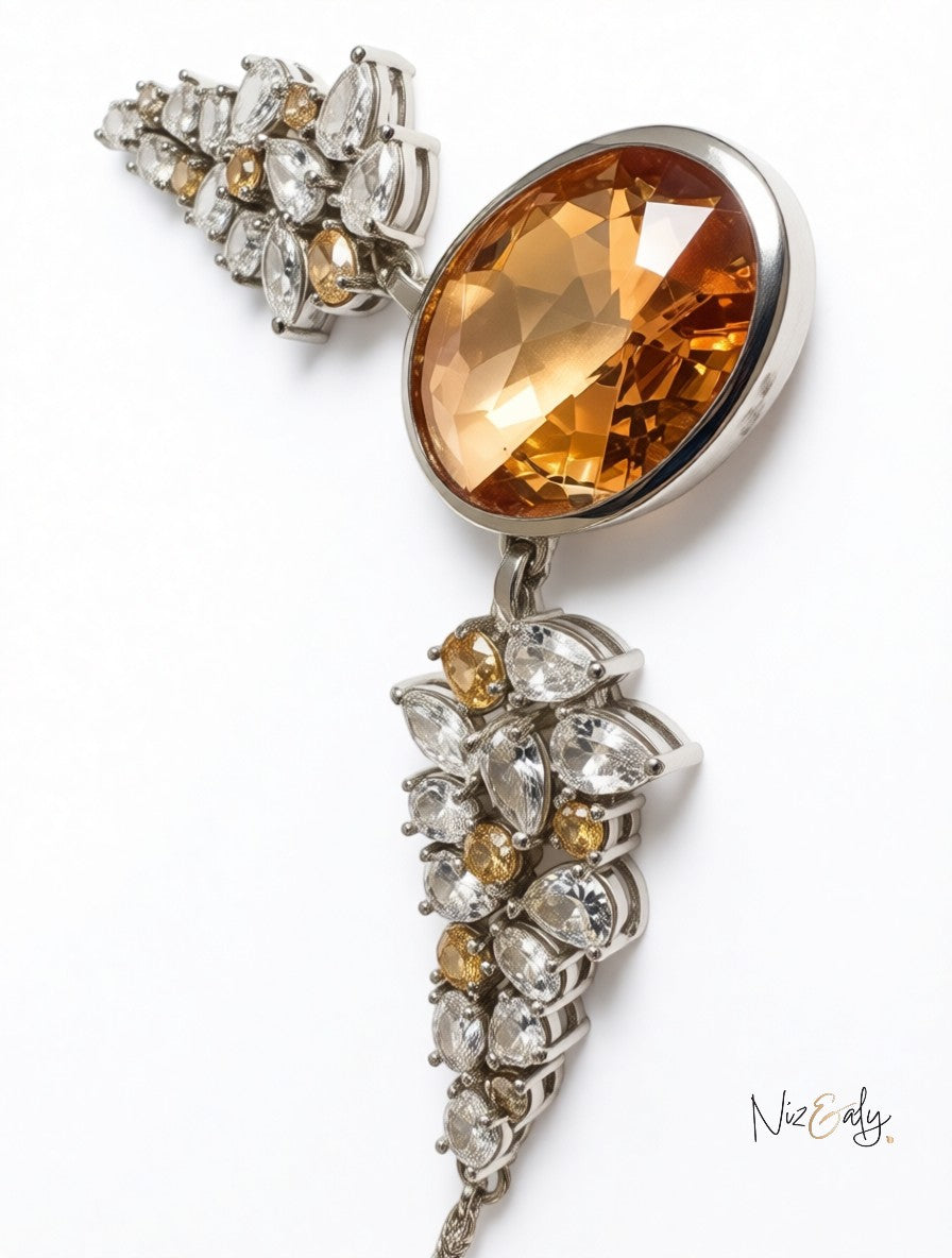 Niz & Aly statement necklace featuring a large champagne-hued oval zirconia pendant with clear and amber crystal accents