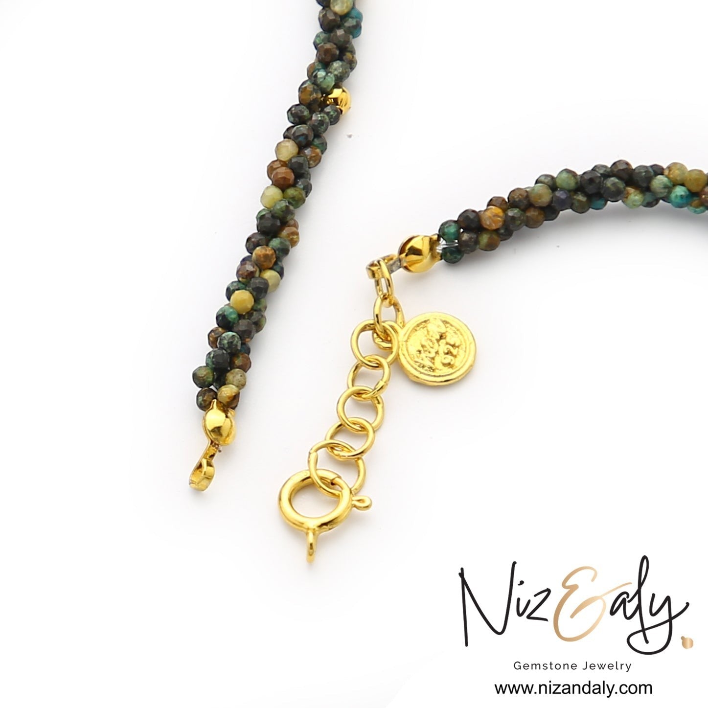 Niz & Aly handcrafted necklace featuring twisted micro turquoise strands and a gold clasp with a branded coin charm.