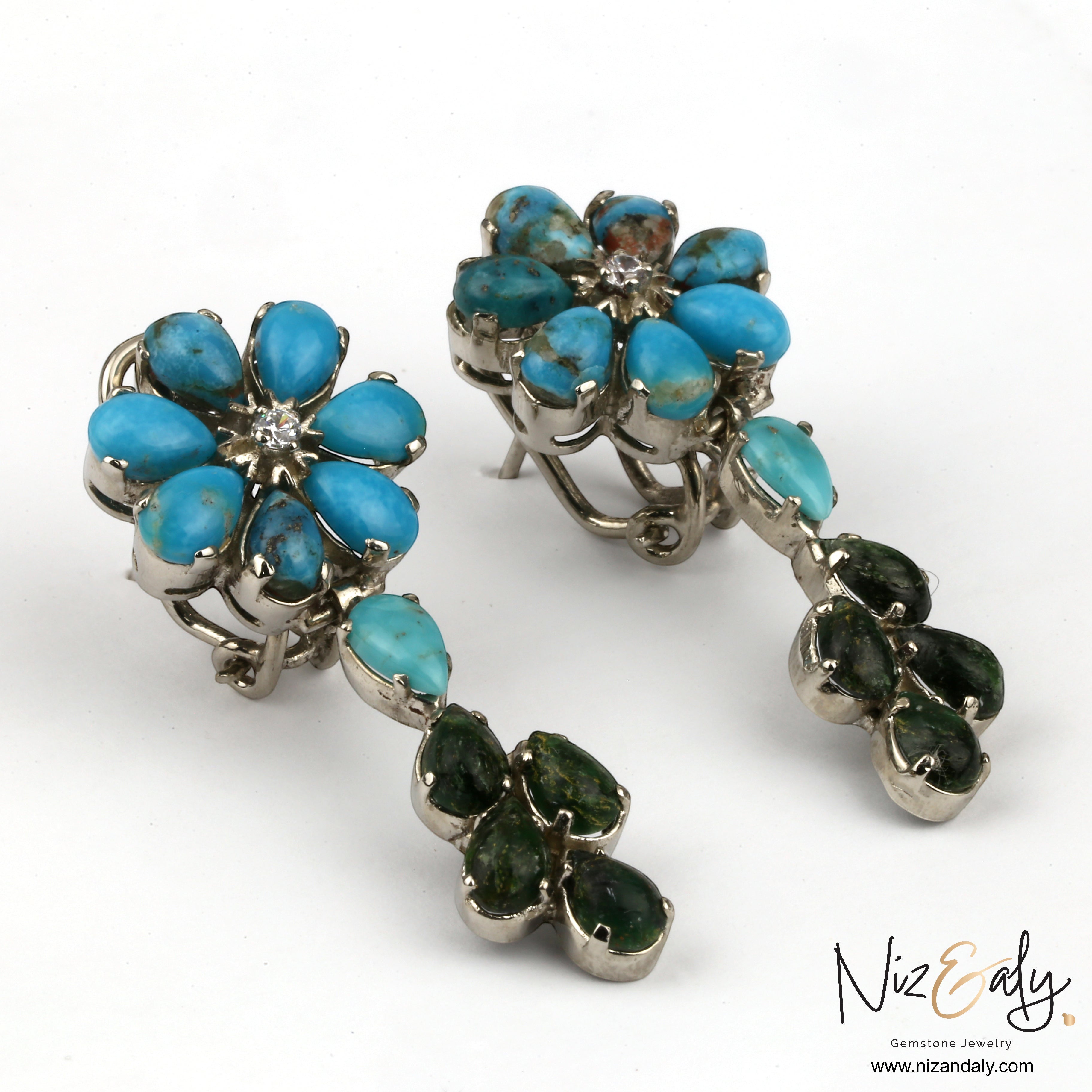 Niz & Aly turquoise and green gemstone flower chandelier earrings with silver settings on a white background.