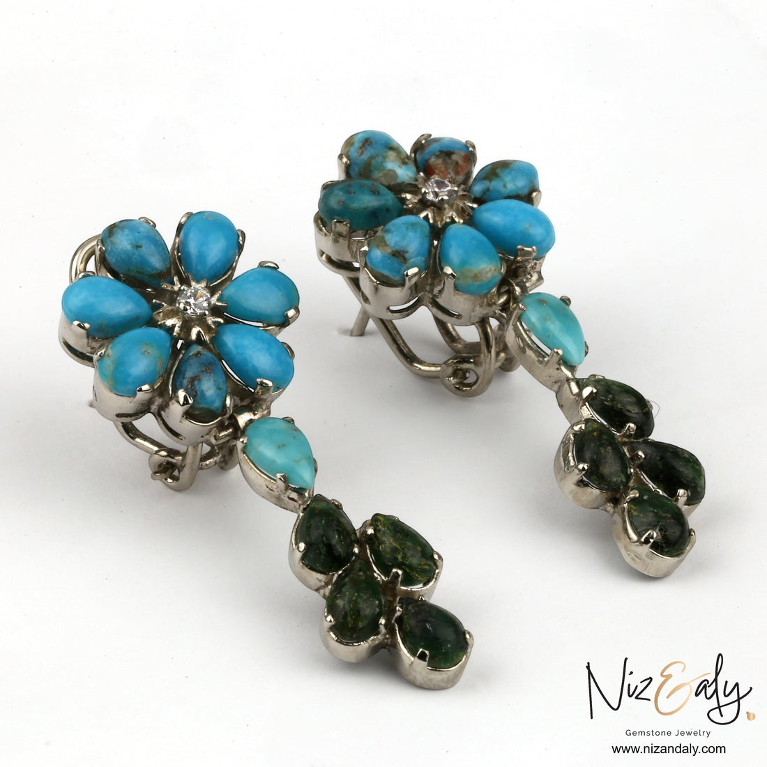 Niz & Aly turquoise and green gemstone flower chandelier earrings with silver settings on a white background.