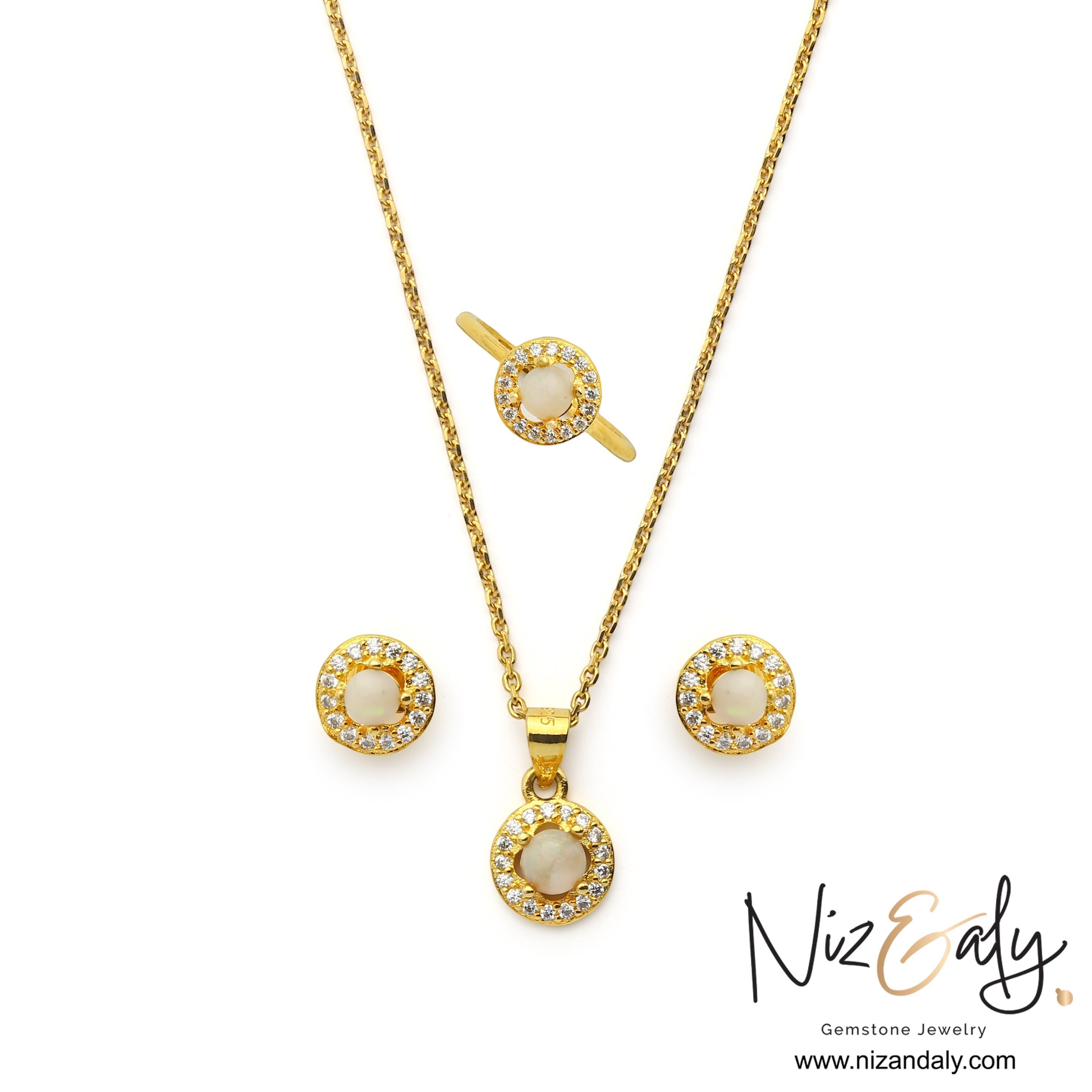 Niz & Aly Opalea jewelry set featuring a round white Australian opal pendant, stud earrings, and ring with halo settings.