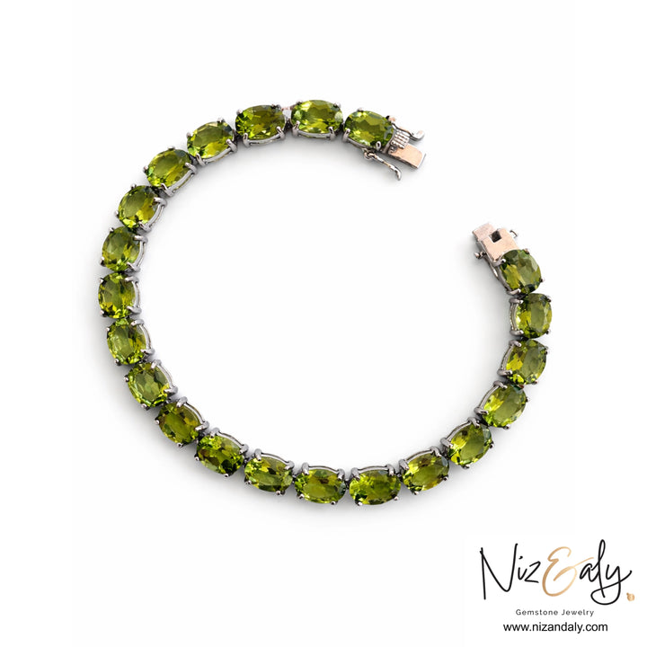 Natural peridot tennis bracelet in rhodium-plated sterling silver