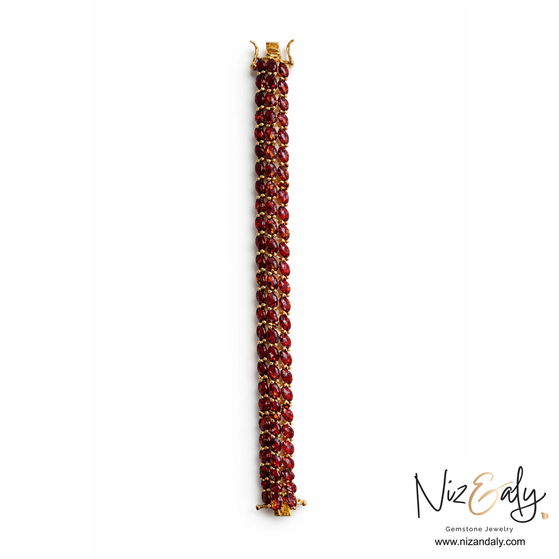 Red beaded bracelet with gold clasp on a white background, branded 'Niz & Aly'.