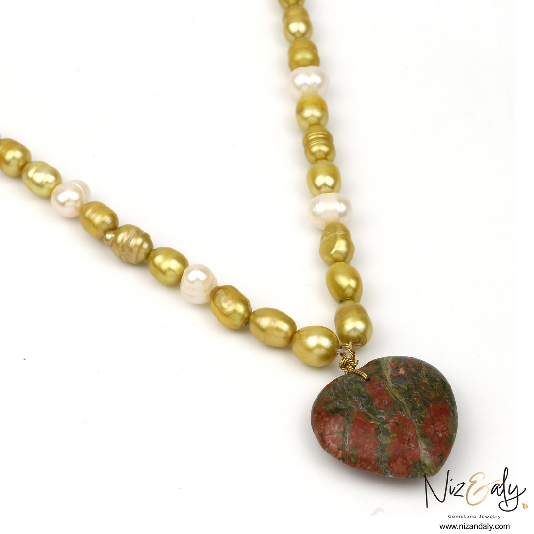 Close up of Unakite Jasper pendant on cultured pearl necklace